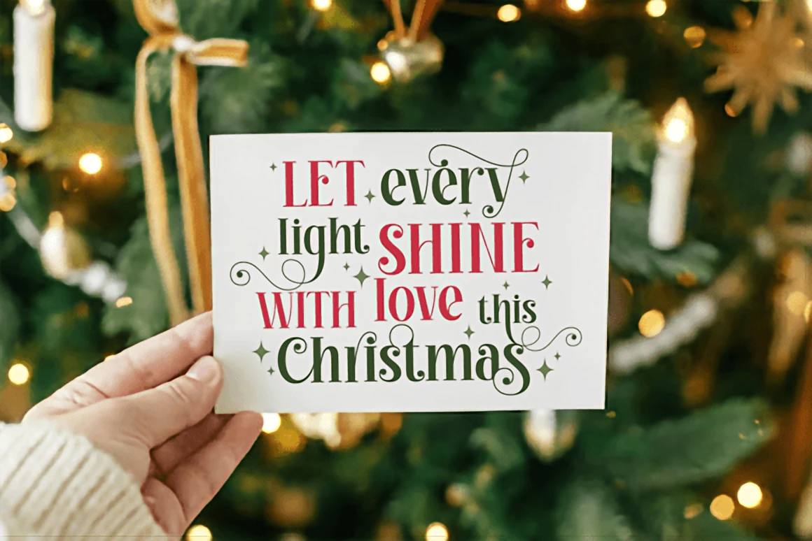 Shiny Christmas – Elegant Festive Serif Display Font 2 Shiny Christmas modern decorative serif font displayed with elegant swirls, red lettering, and festive greenery on a soft winter background.