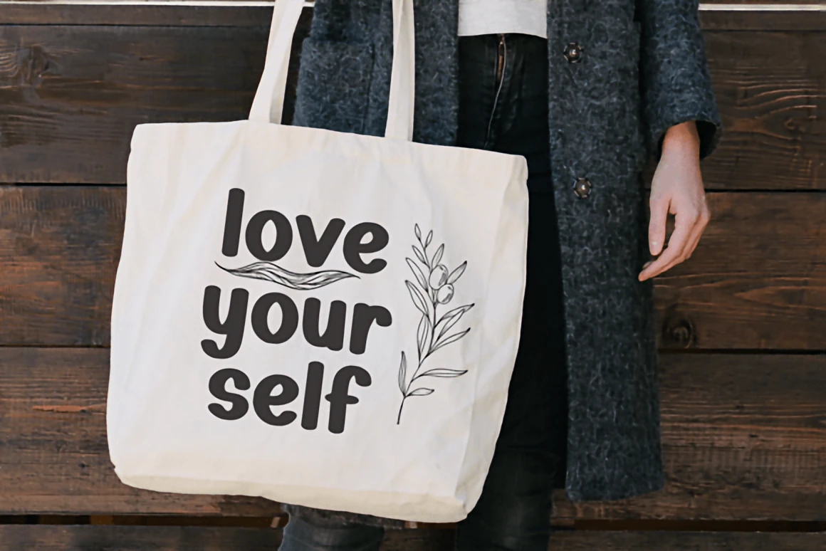 Top 10 Christmas Fonts to Elevate Your Holiday Designs 19 Holiday Christmas rounded handwritten font displayed on a snowy forest background with warm glowing lights and decorative golden frame.