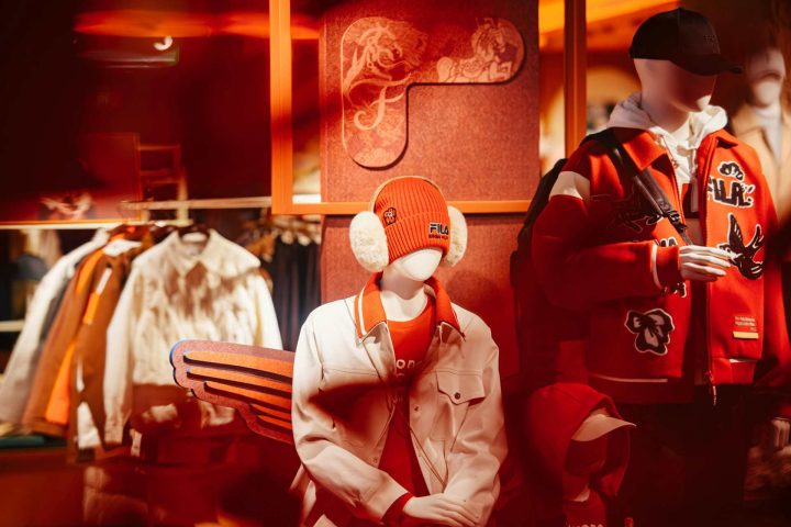 Stylish mannequins dressed in trendy fashion apparel and accessories in a boutique display.